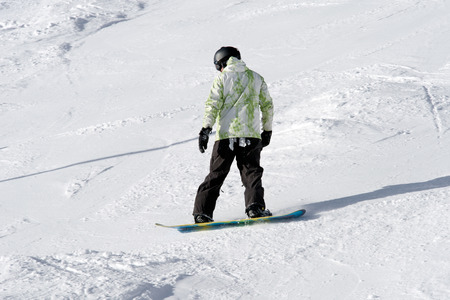 Snowboarder on the slope. Winter sport activityの写真素材