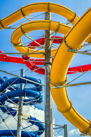 Long colorful water slides in aquapark at summerの写真素材