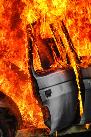 Burning car after accident on road. Flames and fireの写真素材