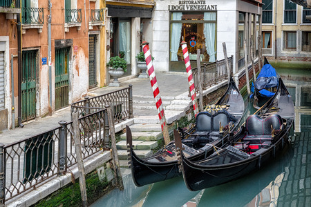 VENICE, ITALY - FEBRUARY 11: Empty gondolas in front of restaurant on February 11, 2018 in Veniceのeditorial素材