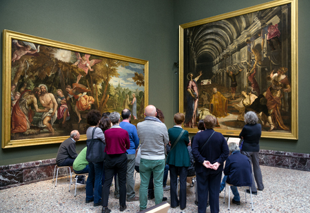 MILAN, ITALY - APRIL 14:  Visitors looking at Tintoretto painting The Finding of the Body of Saint Mark in gallery Pinacoteca di Brera on April 14,2 018 in Milanのeditorial素材