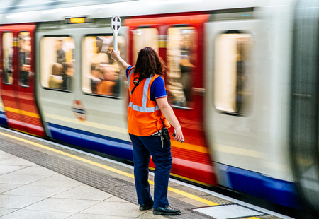 LONDON, UNITED KINGDOM - MAY 14: Dispatcher in Westminster subway station on May 14, 2018 in Londonのeditorial素材