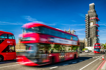LONDON, UNITED KINGDOM - MAY 14: Red double decker on the bridge and Big Ben on May 14, 2018 in...