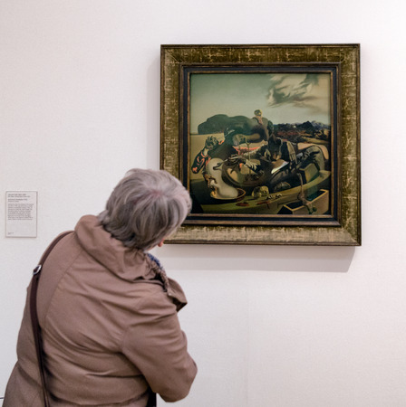 LONDON, UNITED KINGDOM - MAY 12: Visitor looking at Salvador Dali oil painting Autumnal Cannibalism paintings at Tate modern on May 12, 2018 in Londonのeditorial素材