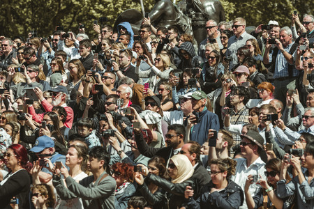 LONDON, GREAT BRITAIN - MAY 14: Crowd of people in front of Buckingham palace shooting photo on May 14, 2018 in Londonのeditorial素材