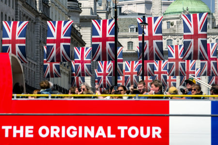 LONDON, UNITED KINGDOM - MAY 14: Tourists at sightseeing double decker bus in centre of cityon May...
