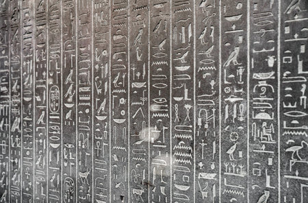 Ancient egyptian hieroglyphs on the wall. Hieroglyphic carvings