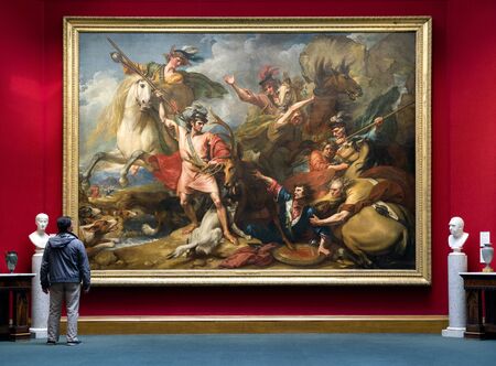 EDINBURGH, SCOTLAND - MAY 19: Man looking at painting in Scottish national gallery on May 19, 2019 in Edinburghのeditorial素材