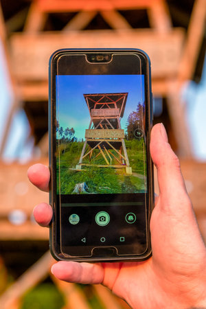 Lookout in village Liptovsky Jan, Slovakia on display of smartphone