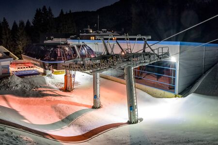 DEMANOVSKA DOLINA, SLOVAKIA - FEBRUARY 8: Empty ski lift chair at night in ski resort Jasna on February 8, 2020 in Demanovska Dolinaのeditorial素材