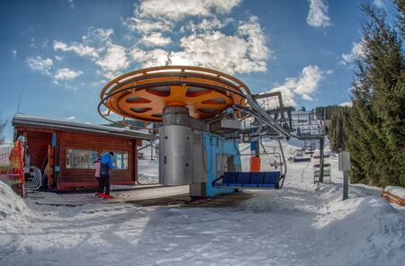 RUZOMBEROK, SLOVAKIA - FEBRUARY 15: Ski lift chair bottom station in ski resort Malino Brdo on February 15, 2020 in Ruzomberokのeditorial素材