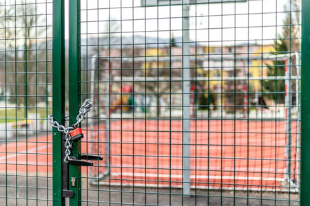 Closed basketball court and children playground. Coronavirus COVID-19 restrictions