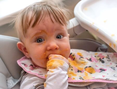 Dirty face of feeding baby.の写真素材