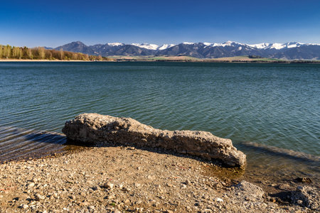 Flooded village and water reservoir Liptovska Mara, Slovakia. Low Tatras mountains at backgroundの写真素材