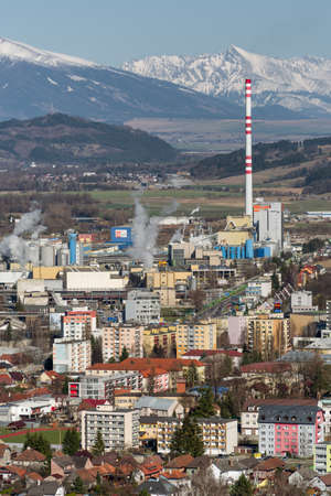 RUZOMBEROK, SLOVAKIA - MARCH 27: Factory Mondi at town and hill Krivan on March 27, 2019 in Ruzomberokのeditorial素材