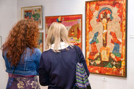 RUZOMBEROK, SLOVAKIA - SEPTEMBER 19: Visitors looking at Ludovit Fulla painting in his gallery on September 19, 2019 in Ruzomberokのeditorial素材
