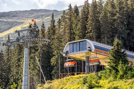 DEMANOVSKA DOLINA, SLOVAKIA - AUGUST 24, 2020: Modern ski lift chair in resort Jasna in Low Tatras mountainsのeditorial素材