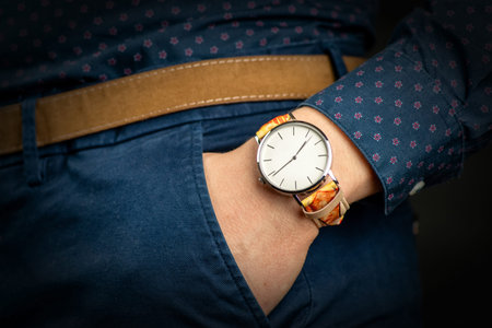 Elegant colorful wristwatch. Hand in pocket.