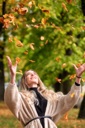 Pretty face girl in autumn park.の写真素材