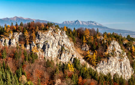 Rock formations Haliny in Great Fatra mountains, Slovakia. Hill Krivan from High Tatras mountains at background.の写真素材