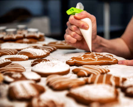 Decorating of Christmas homemade gingerbread cookies.の写真素材