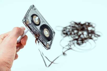 Rewind a old audio cassette with loose tape - vintage styleの写真素材