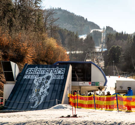 BANSKA STIAVNICA, SLOVAKIA - FEBRUARY 27, 2022: Bottom station of ski-lift chair at Salamandra resort in winter season.のeditorial素材