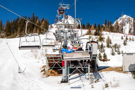 TATRANSKA LOMNICA, SLOVAKIA - MARCH 12, 2022: Ski-lift chairs in resort Tatranska Lomnica in High Tatras mountainsのeditorial素材