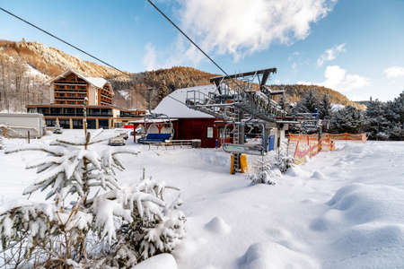 VALCA, SLOVAKIA - JANUARY 22, 2022: Bottom station of ski-lift chair at resort Snowland Valca in winter season.のeditorial素材