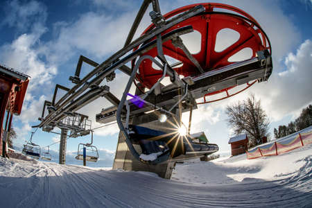 VALCA, SLOVAKIA - JANUARY 22, 2022: Upper station of ski-lift chair at resort Snowland Valca in winter season.のeditorial素材