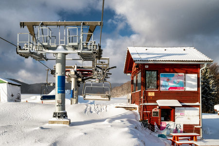 VALCA, SLOVAKIA - JANUARY 22, 2022: Upper station of ski-lift chair at resort Snowland Valca in winter season.のeditorial素材