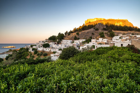 LINDOS, GREECE - JULY 1, 2022: Lindos acropolis above old town in Rhodes island in Greeceのeditorial素材