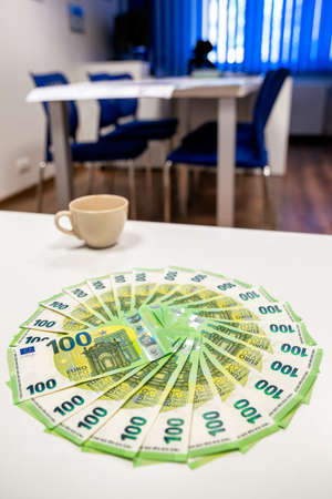 Euro cash. 100 hundred banknotes on white tableの写真素材