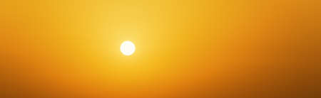 Colorful sunset. Sunlight from sun on yellow sky. Panoramic wallpaperの写真素材