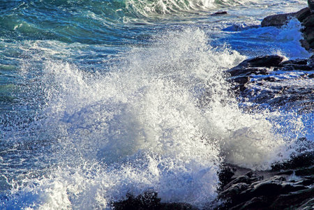 Waving sea on the coastline. Splash water. Stormy sea