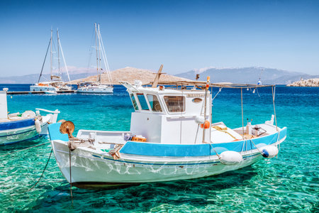 Halki, Greece - July 6, 2022: Fishing boat in port in island Halki (Chalki) in Greeceのeditorial素材
