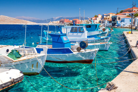 Halki, Greece - July 6, 2022: Fishing boats in port in island Halki (Chalki) in Greeceのeditorial素材