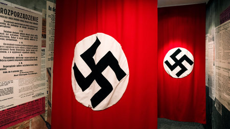 Krakow, Poland - February 19, 2018: Nazi swastika flag displayed inside the Oskar Schindler Enamel Factory museum as part of a historical World War II exhibition.のeditorial素材