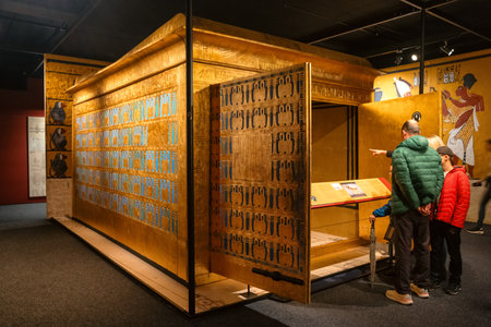 Bratislava, Slovakia - November 25, 2015: Golden ancient Egyptian sarcophagus displayed inside the Tutankhamun exhibition, presenting burial rituals, hieroglyphic decoration and beliefs of ancient Egyptian civilization.のeditorial素材