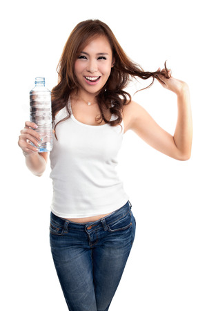 Young beautiful woman holding bottle of water  Healthy lifestyle concept, isolated on white backgroundの写真素材