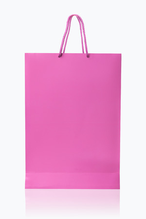 Pink shopping bag, isolated with clipping path on white background  Pink shopping bag with reflect and copy spaceの写真素材