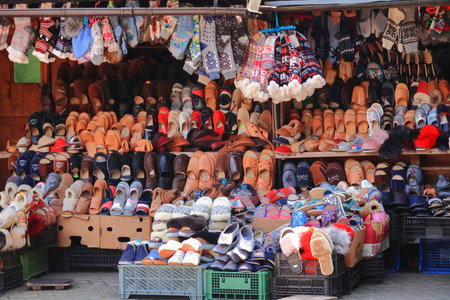 Shelves with warm winter clothes for sale in a flea market