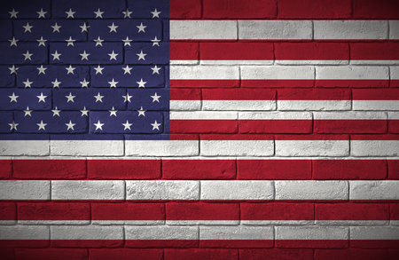 The flag of the United States painted on a brick wall.の写真素材