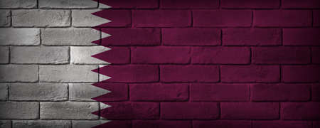 Qatar flag painted on a brick wall. The flag proportions and RGB colors are reproduced.の写真素材
