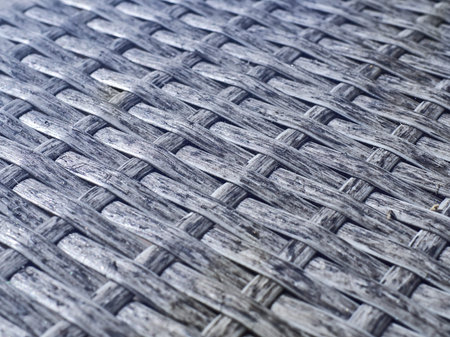 Black plastic woven table texture closeup.の写真素材