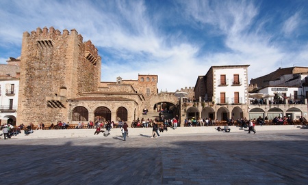 CACERES, SPAIN - APRIL 23: Locals and tourist enjoying a sunny day and waiting for the start of the holy week processions on April 24, 2011 in the main square of Caceres (Spain)のeditorial素材