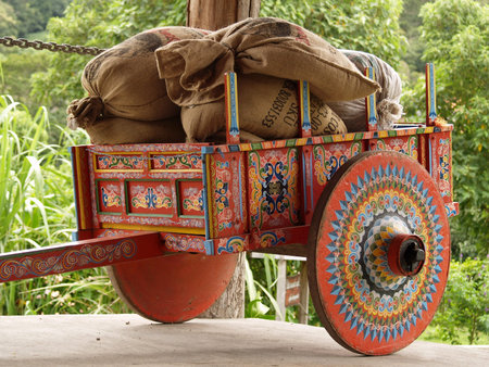 Colorful Costa Rican Ox Cart loaded with coffee bags