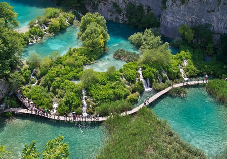 PLITVICE, CROATIA - JULY 7: Tourist enjoy sightseeing the lakes and wonderful landscapes at the Plitvice natural Park in Croatia during the summer holidays, on July 7th, 2011 in Plitvice, Croatiaのeditorial素材