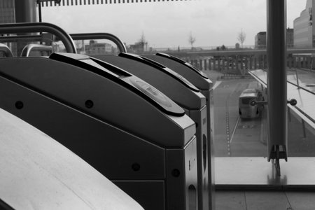 Utrecht, the Netherlands, February 15, 2019: a black and white sideview of the check in gates of the NS utrecht central stationのeditorial素材