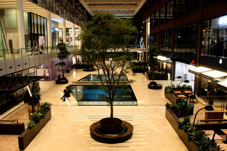 Modern shopping mall with trees and water inside from a high viewのeditorial素材
